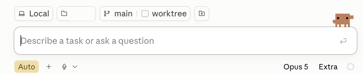 The bottom strip of the Claude Code Desktop window: four small buttons reading Local, an empty folder button, main, and worktree, then a wide box reading Describe a task or ask a question, then a yellow Auto button, a plus, a microphone, and on the right the words Opus 5 and Extra
