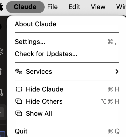The Claude menu open at the top left of the screen beside the Apple symbol, holding About Claude, Settings, Check for Updates, Services, Hide Claude, Hide Others, Show All and Quit